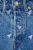 h&amp;m-jeansowe-krotkie-spodenki-w-muchy-zblizenie.webp