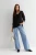 new-look-czarny-asymetryczny-sweter-v-neck-modelka-przod2.webp
