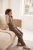 next-bezowy-sweter-golf-z-falbanka-prazkowany-modelka-bok.webp