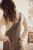 next-bezowy-sweter-golf-z-falbanka-prazkowany-modelka-tyl.webp