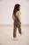 next-bezowy-sweter-golf-z-falbanka-prazkowany-modelka-tyl2.webp