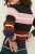 New-Look-wielokolorowy-sweter-w-pasy-modelka-tyl.webp