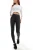 M&amp;CO-Kylie-dziewczece-czarne-woskowane-spodnie-jeansy-modelka-przod.webp