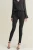Next-czarne-spodnie-jeansy-lift-slim-shape-skinny-wysoki-stan-guziki-modelka-przod.webp