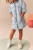 Next-dziecieca-jeansowa-sukienka-jasny-jeans-modelka.webp