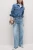 M&S-jasne-jeansy-spodnie-wilde-szerokie-nogawki-modelka-przod.webp