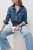 M&S-jasne-jeansy-spodnie-wilde-szerokie-nogawki-modelka-przod2.webp