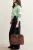 New-Look-mietowy-sweter-golf-modelka-bok.webp