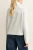 New-Look-szary-sweter-golf-modelka-tyl.webp