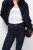 M&S-Lily-Slim-granatowe-jeansowe-spodnie-skinny-jeansy-modelka-zblizenie.webp