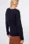 Dorothy-Perkins-granatowy-sweter-sploty-warkocze-modelka-tyl.webp