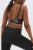 M&S-biustonosz-sportowy-modelka-tyl.webp