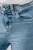 Next-jasne-jeansowe-melanzowe-damskie-jeansy-modelka-zblizenie.webp