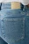 Next-jasne-jeansowe-melanzowe-damskie-jeansy-modelka-zblizenie2.webp