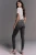 Next-grafitowe-jeansowe-damskie-jeansy-modelka-tyl.webp