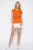 Victoria-Secret-pomaranczowa-bluzka-t-shirt-cekiny-modelka.webp