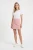 Topshop-trapezowa-rozowa-spodniczka-mini-modelka.webp