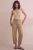 Next-lniane-camel-spodnie-len-modelka-przod.webp