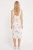 Atmosphere-kremowa-sukienka-w-kwiaty-pasek-modelka-tyl.webp