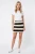 H&M-mini-spodniczka-w-bezowo-czarne-pasy-modelka-przod.webp