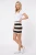 H&M-mini-spodniczka-w-bezowo-czarne-pasy-modelka-przod2.webp