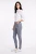 Damskie-jasne-spodnie-jegginsy-w-kratke-modelka-bok.webp