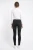 H&M-czarne-odcinane-spodnie-jeansy-modelka-tyl.webp