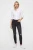 H&M-czarne-spodnie-jeansowe-z-dziurami-modelka-przod.webp
